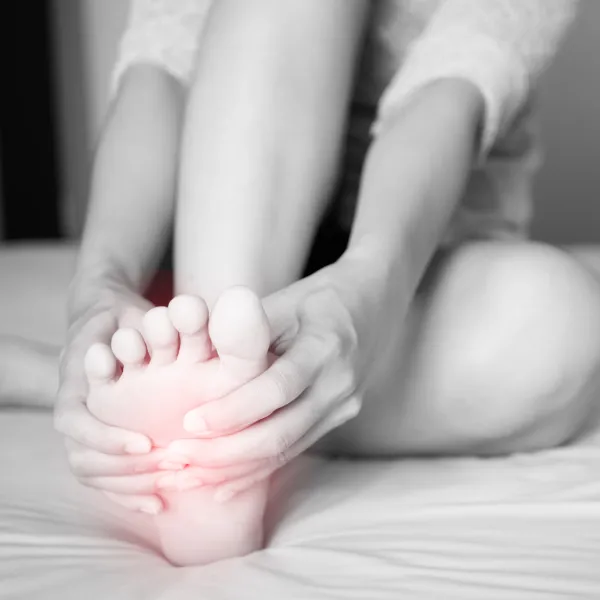 Chiropractic Groton CT Woman Clutching Painful Foot