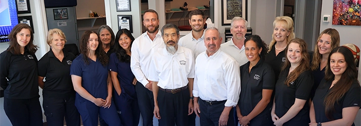 Chiropractors Matthew McNicholas, Daniel Mascaro, Michael Thomas, And Warren Geruso With Acupuncturist Huan Zhang And Support Team